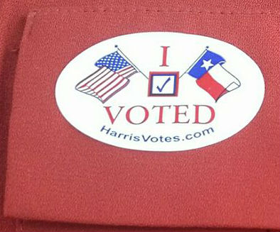 An 'I voted' sticker on a red background