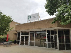 The picture is of a coffee shop that is being remodeled, with a sign indicating ongoing construction.