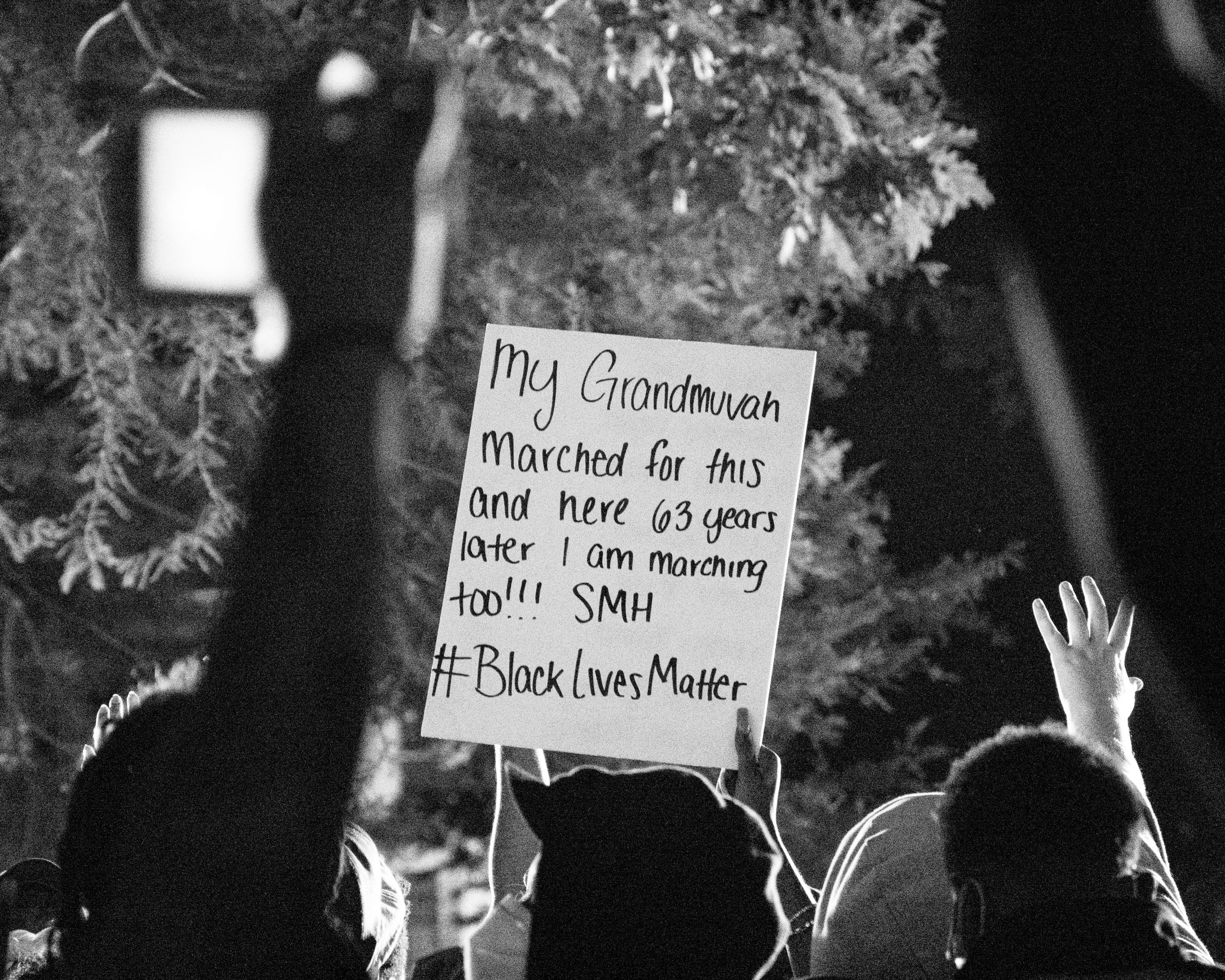 Image 3 - This stock photo shows a protestor’s sign that reads, "My grandmuvah marched for and 63 years later I am marching too!!! SMH #BlackLivesMatter